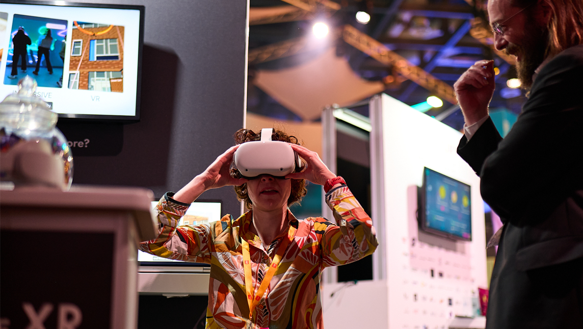A delegate uses a VR headset at Digifest
