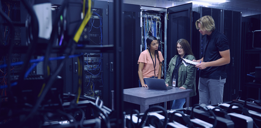 Team of technicians working in server room