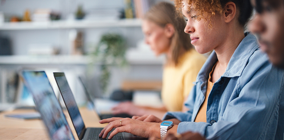 A female student using a laptop.