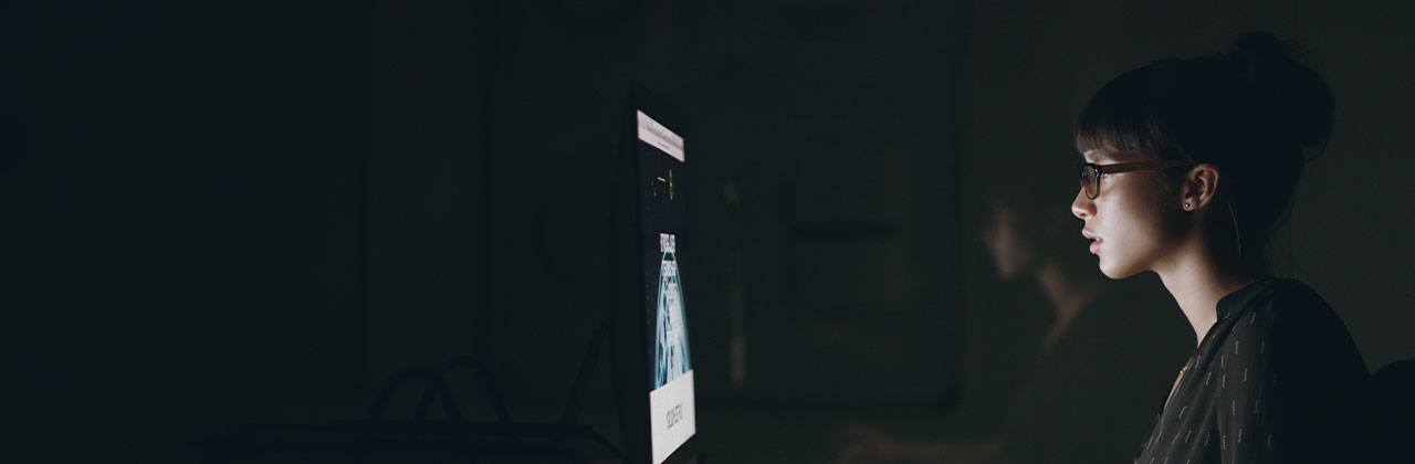 Worker studying data on a screen
