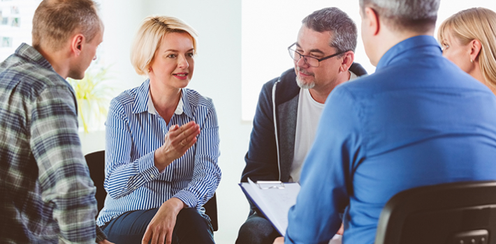 A group of professionals in discussion.