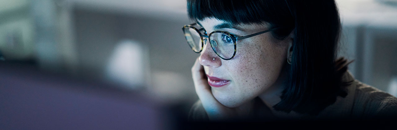 Woman staring at computer screen