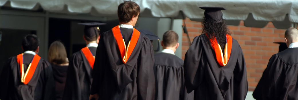 Students wearing gowns at graduation ceremony