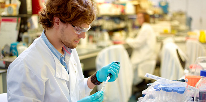 Scientist using micro pipette with DNA.