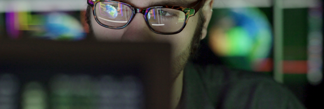 Man studying data on a screen