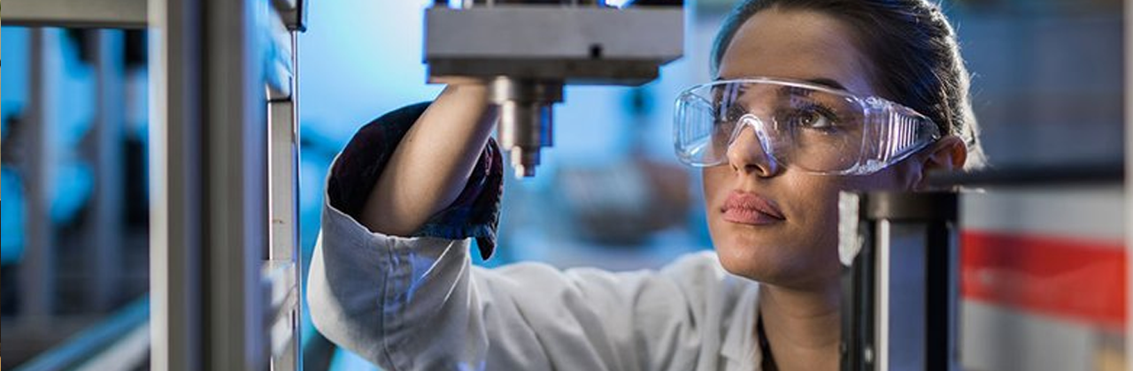 A researcher uses equipment in a lab.