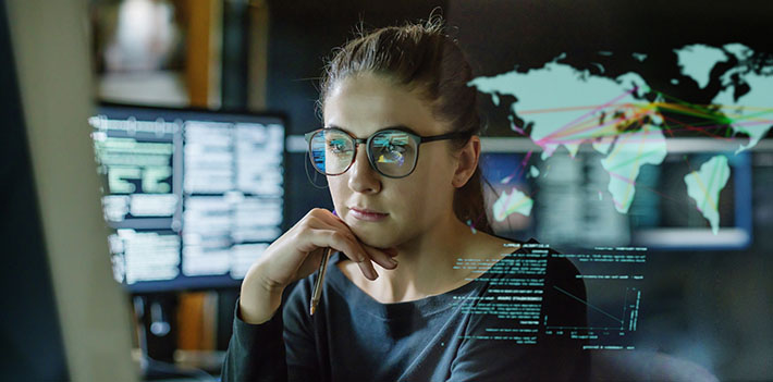 Female researcher looking at a computer screen.