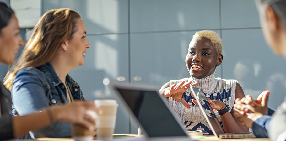 A group of staff talking in a meeting.