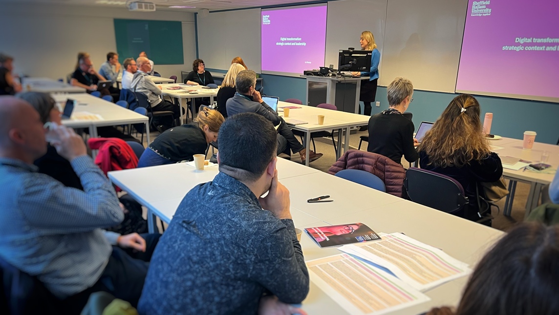 A member of staff gives a lecture to a class of students at Sheffield Hallam University.