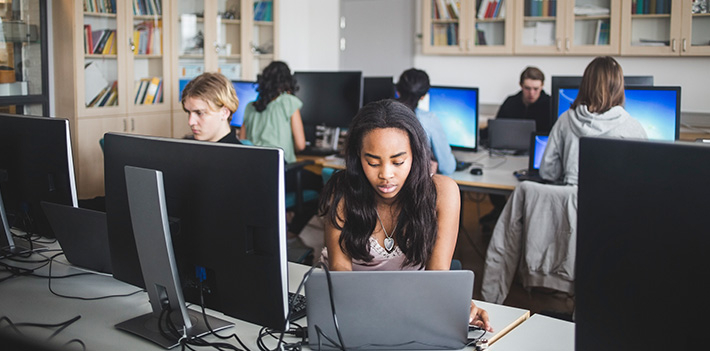 Students study in a computer room.