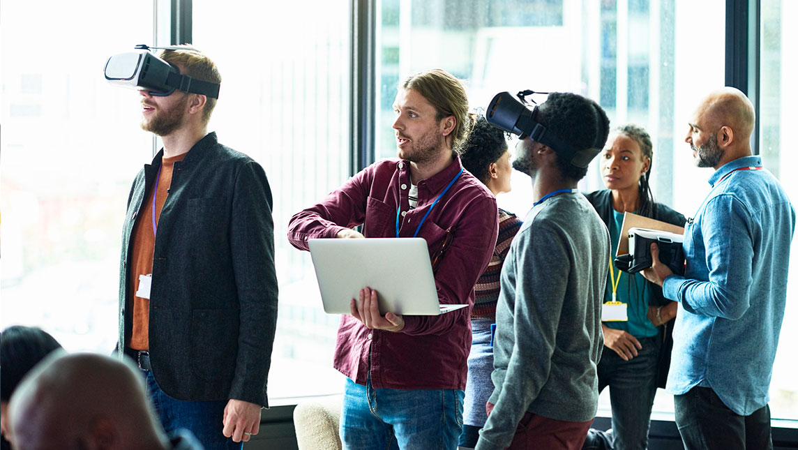 Group of colleagues wearing VR headsets in a demonstration
