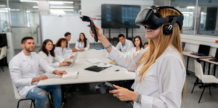 A student wears a virtual reality headset in the classroom.